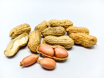 High angle view of bread on table against white background