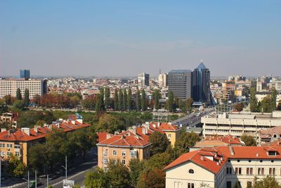 View of cityscape against blue sky