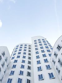 Low angle view of modern buildings against sky