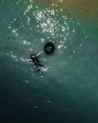 High angle view of man swimming in sea