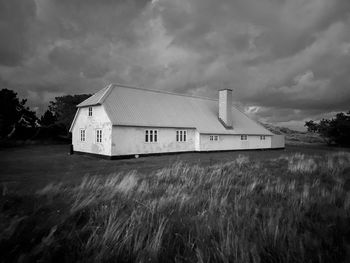 House on field against sky