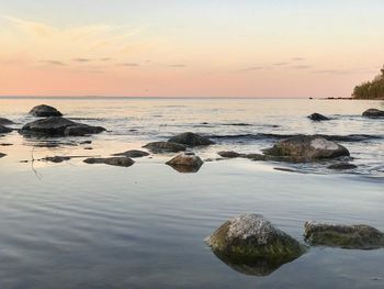 Scenic view of sea against sky during sunset
