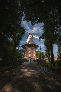 Traditional windmill against sky