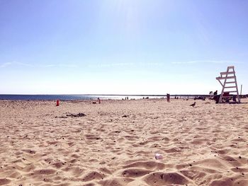 Scenic view of beach against blue sky