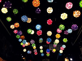 Low angle view of illuminated lanterns hanging on ceiling