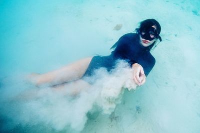 High angle view of man swimming in sea