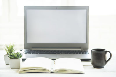 Open book on table at home