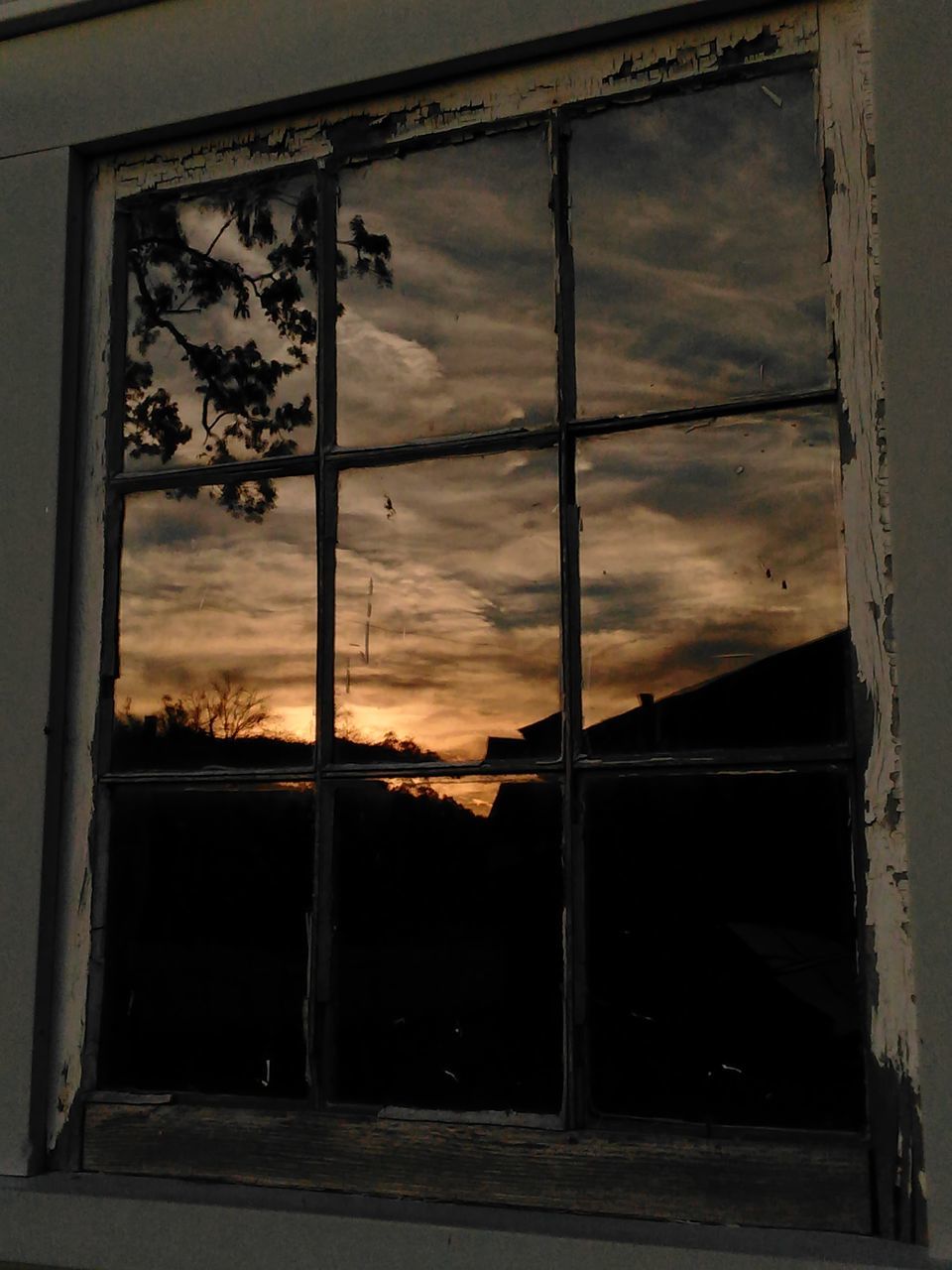 architecture, built structure, window, building exterior, sky, house, cloud - sky, closed, old, abandoned, residential structure, door, damaged, glass - material, obsolete, weathered, no people, cloud, residential building, low angle view