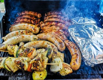 High angle view of meat on barbecue