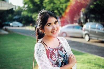 Portrait of smiling woman standing outdoors