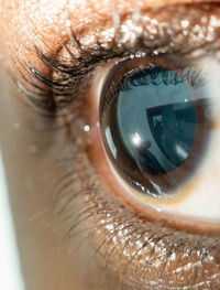 Close up of african american mans dark brown eyes for use in ophthalmology optometry imagery