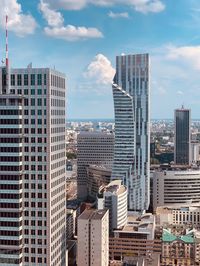 Modern buildings in city against sky