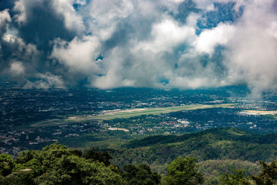 Aerial view of landscape against cloudy sky