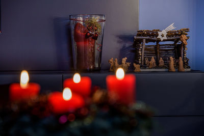 Illuminated candles in temple