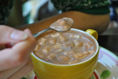 Close-up of hand holding drink