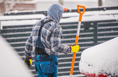 Man working on snow