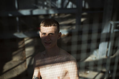 Portrait of young man standing outdoors