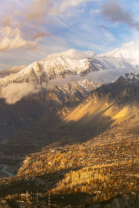 Scenic view of snowcapped mountains against sky