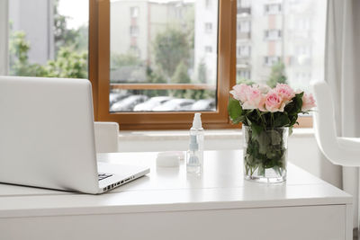 Decorative cosmetics on the table in empty beauty salon, ordering on-line, making appointment with