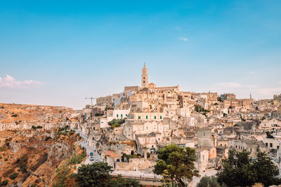 Sassi di matera from the belvedere colombo blue sky with clouds