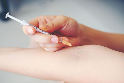 Close-up of woman holding hands