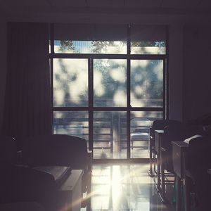 Empty chairs in window