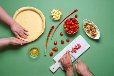 High angle view of woman preparing food on cutting board