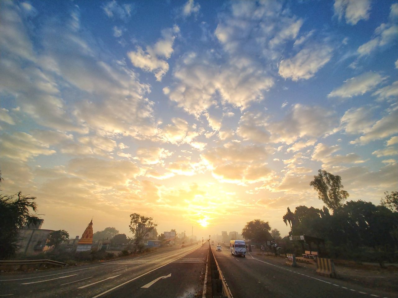 ROAD AGAINST SKY DURING SUNSET