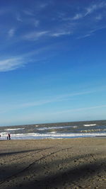 View of beach against cloudy sky