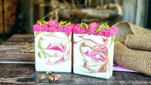 Close-up of pink roses on table