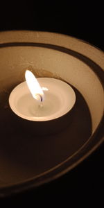 High angle view of illuminated lamp on black background