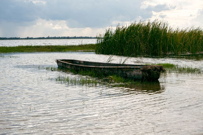 Fisherman's boat moored in the river the evening air, the sun is almost setting