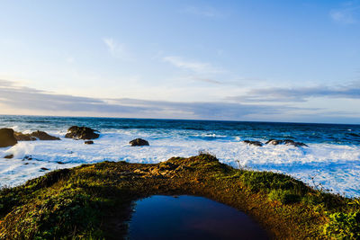 Scenic view of sea against blue sky