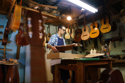 Man working at illuminated table