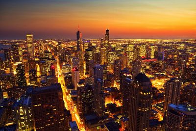 High angle view of chicago lit up at sunset