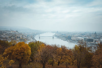 Scenic view of river against sky during autumn