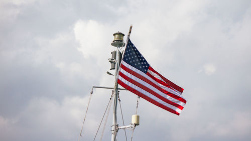 Low angle view of flag against sky