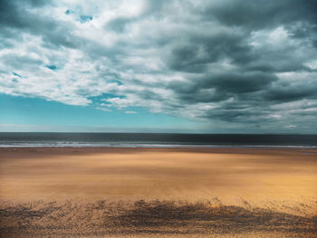 Cloudy yellow beach in normandy