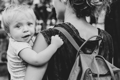 Portrait of cute boy with woman