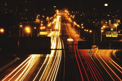 High angle view of light trails on road at night