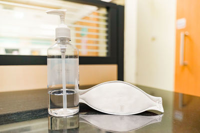 Close-up of water bottle on table at home