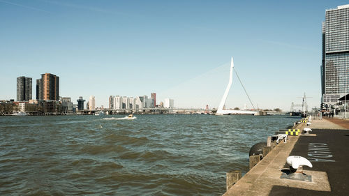 View of suspension bridge with city in background