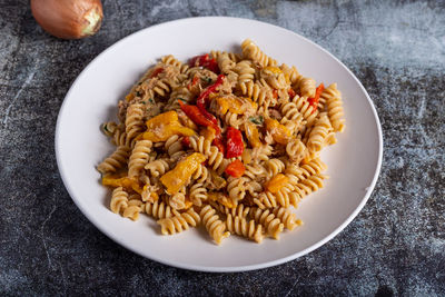 Pasta with peproni, tuna and onion. typical dish of the mediterranean diet