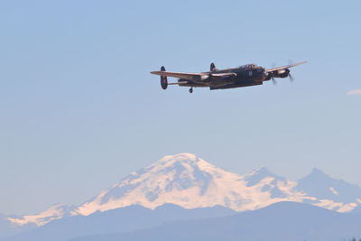 Low angle view of airplane flying in sky