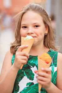 Portrait of cute girl eating ice cream