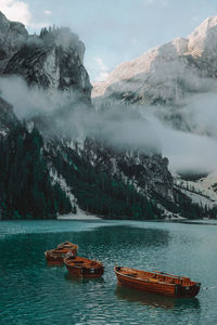 Scenic view of lake by snowcapped mountains