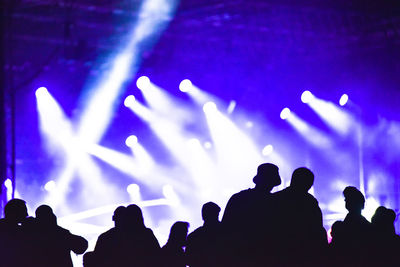 Silhouette people at music concert