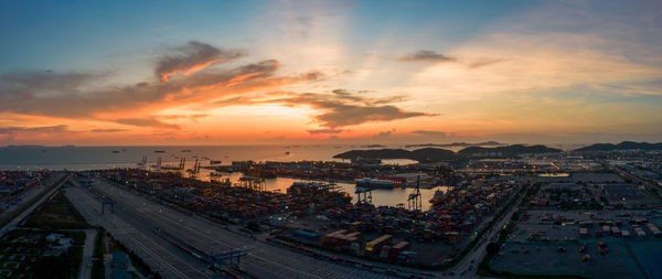 High angle view of city street against sky during sunset