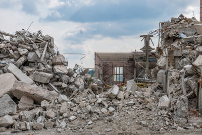 Damaged building against sky