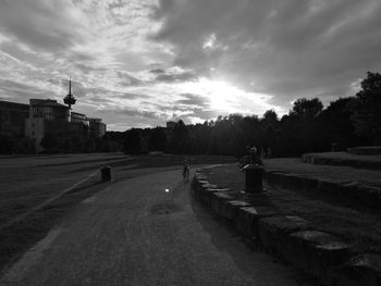 Empty road along buildings